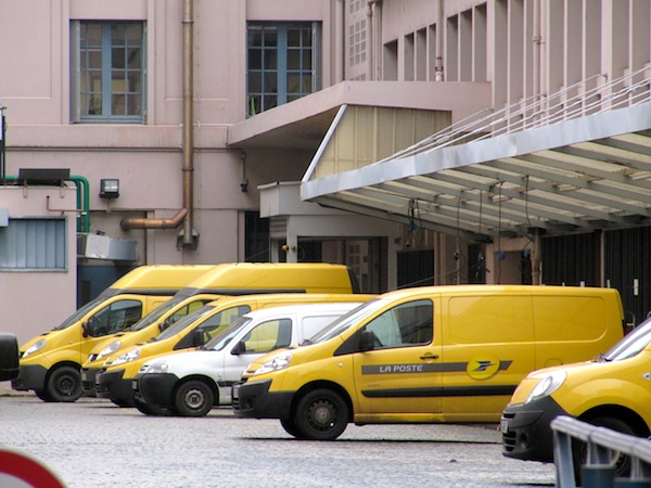 Vehicles waiting outside a La Poste office